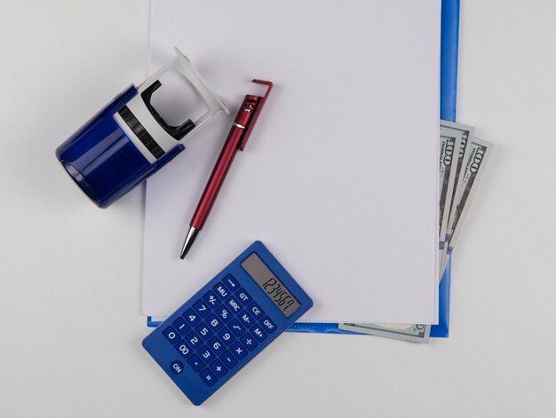 A close-up of a U.S. tax form with a calculator, pen, and notepad, symbolizing meticulous tax preparation and financial planning.