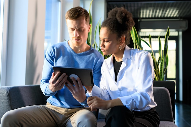 A mental health professional creating a personalized wellness plan with a patient, using digital tools and assessments.