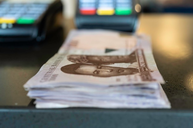 A close-up of a newspaper headline announcing the Federal Reserve's latest interest rate hike, with a blurred background showing a cityscape. The image conveys the news impacting the financial markets and the everyday lives of people looking to buy homes.